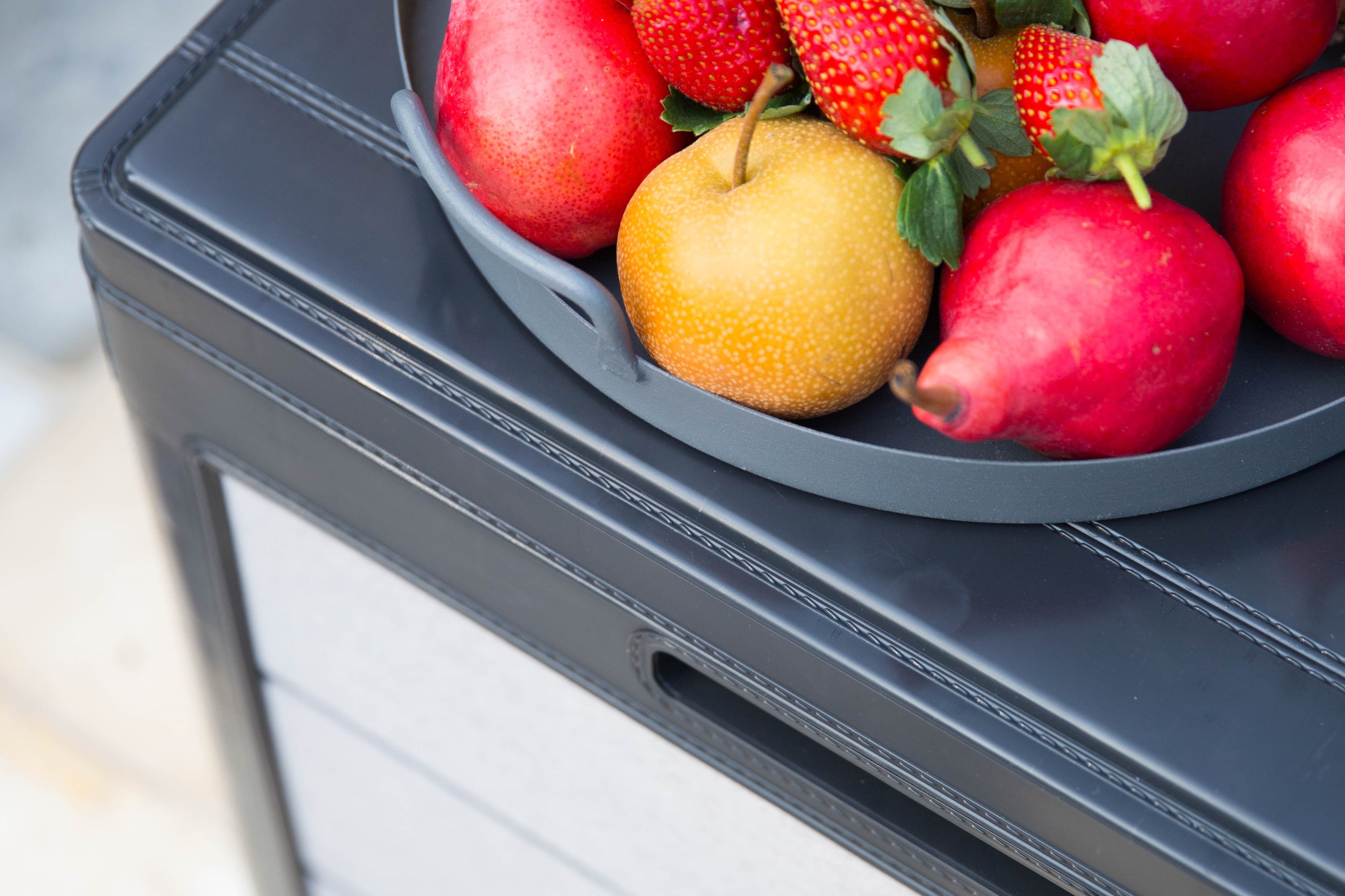 Storage box being used as a table for fruit bowl