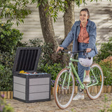 Woman sitting on a bike with the storage box filled with toys