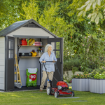 Keter Oakland 754 with woman mowing the lawns
