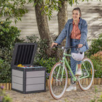 Woman sitting on a bike with the storage box filled with toys