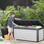 A child getting pool toys out of the Denali Storage box