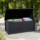 Outdoor cushion box with lid open filled with cushions and sports gear