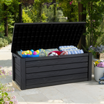 Outdoor cushion box with lid open filled with cushions and sports gear