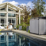 Elite Store poolside with woman relaxing