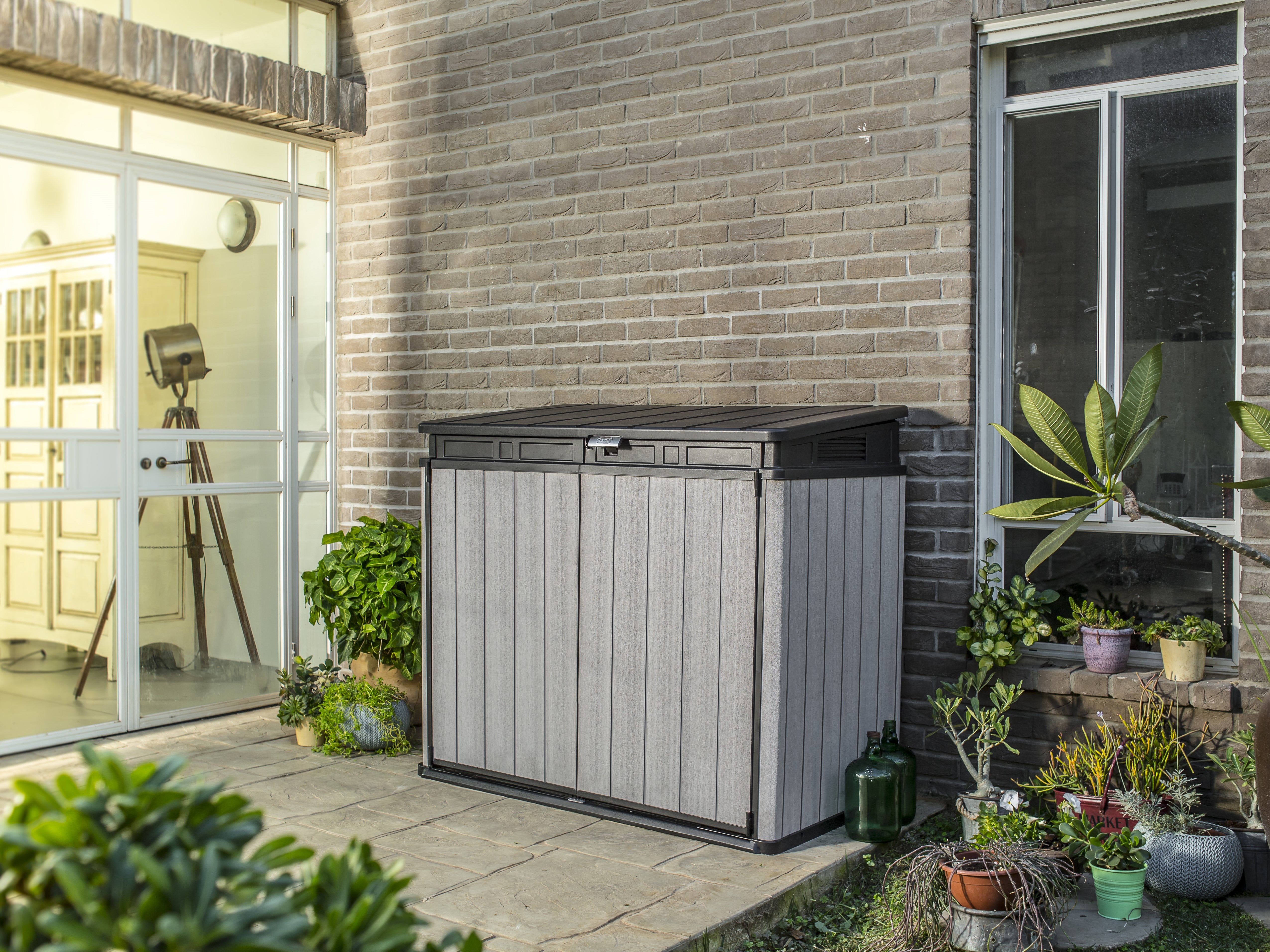 Outdoor storage unit in a courtyard setting