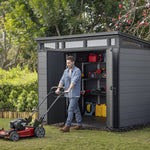 Keter_Cortina_Shed_with_man_mowing_lawns