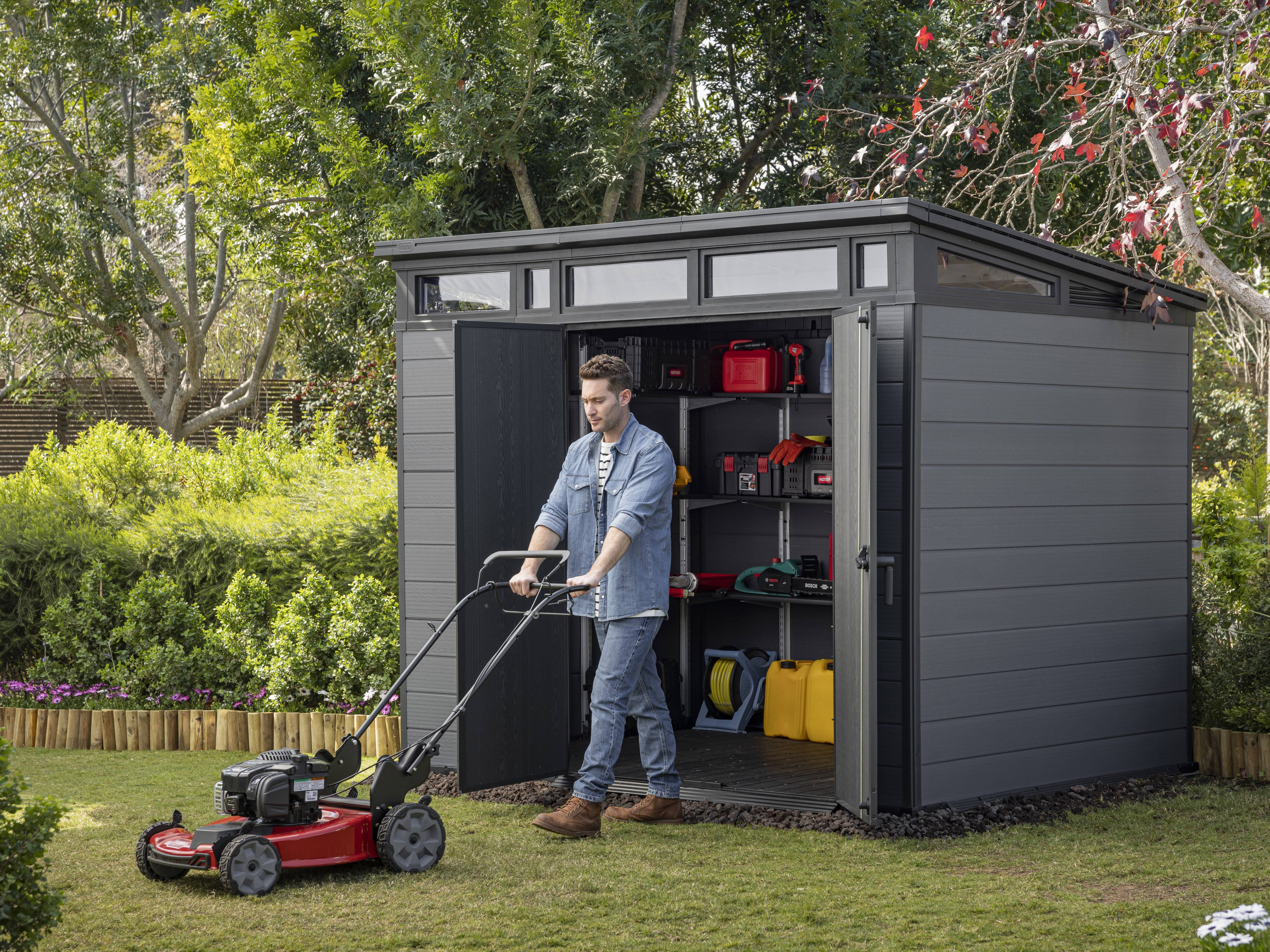 Keter_Cortina_Shed_with_man_mowing_lawns