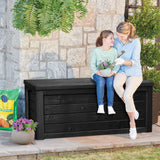 Mother and daughter sitting on the lid of the Keter Eastwood cushion box