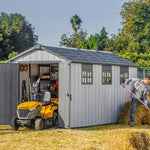 Keter Oakland 7515 shed on sunny day with haybales and ride on mower