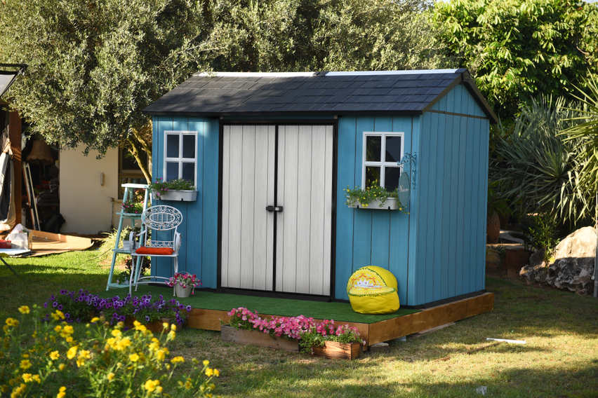 Keter Oakland 1175SD My Shed painted blue with flowers planted in flower boxes